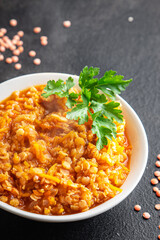 red lentils food vegetable stewed legumes and curry spices ready to eat meal snack on the table copy space food background
