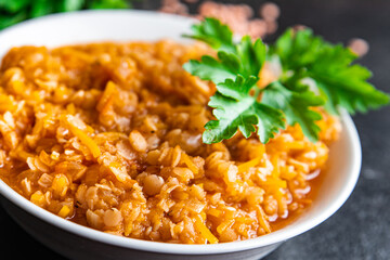 red lentils food vegetable stewed legumes and curry spices ready to eat meal snack on the table copy space food background