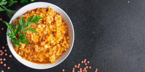 red lentils food vegetable stewed legumes and curry spices ready to eat meal snack on the table copy space food background