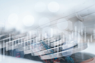 Double exposure of city and rows of coins for money, finance and business concept.