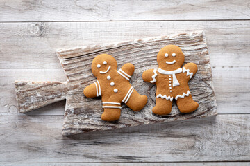 Homemade christmas gingerbread cookies on wooden table.