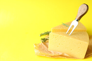 Concept of cooking eating with hard cheese on yellow background