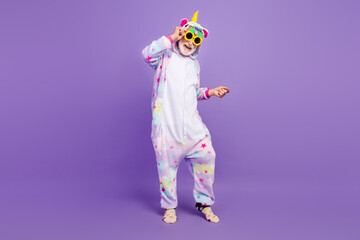 Photo of funky cool retired man nightwear overall dark pineapple eyewear smiling dancing isolated purple color background