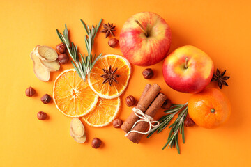 Ingredients for cooking mulled wine on orange background