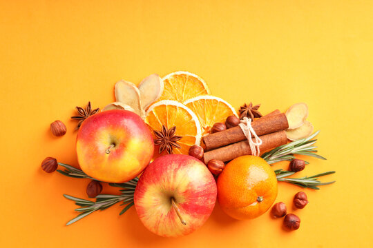 Ingredients for cooking mulled wine on orange background
