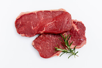 Fresh raw steaks on white background.