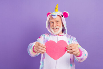 Photo of handsome charming retired man nightwear overall smiling showing you pink heart isolated purple color background