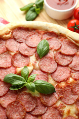 Concept of tasty food with Salami pizza, close up
