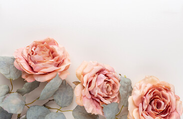 Flowers composition. Bouquet of pink roses in pastel colors. Flatlay.