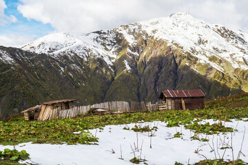 The trail to Koruldi lakes from Mestia. Big Caucasus. First snow. Abandoned small house....