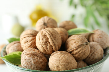 Concept of healthy food with walnuts on white wooden background