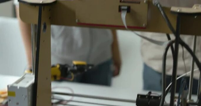 Students checking their 3D printed prototype