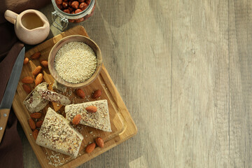 Concept of tasty food with halva on wooden background
