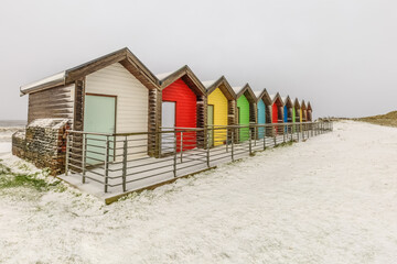 Fototapeta na wymiar Beach huts in Winter on the Northumberland coastline