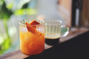homemade orange Americano coffee from free time making drink for healthy living life. selective focus