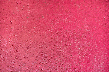 The concrete surface is painted in shades of red and crimson colors