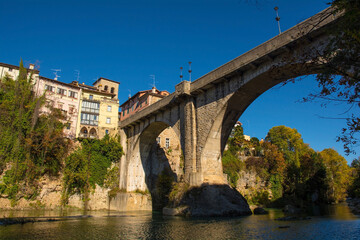 Fototapeta premium The Ponte del Diavolo - the Devil's Bridge - over the Natisone river in the north east Italian town of Cividale del Friuli, Udine Province, Friuli-Venezia Giulia. This 15th century bridge was rebuilt 