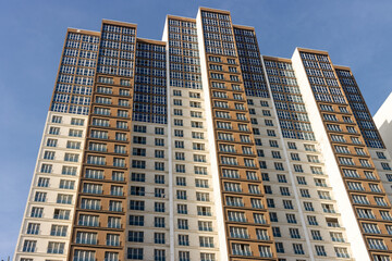 Fototapeta na wymiar New apartment skyscraper building construction. Urban city house concept