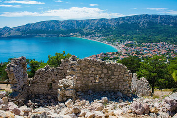 The ruins of the medieval Baska Citadel, Kastel Baska, overlooking the south Krk island town of Baska in the Primorje-Gorski Kotar County of western Croatia

