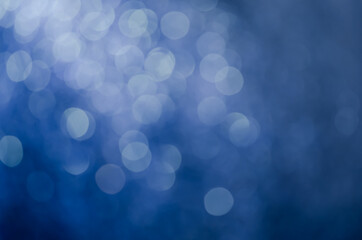 Obraz premium abstract blue bokeh glitter sparkle background.
