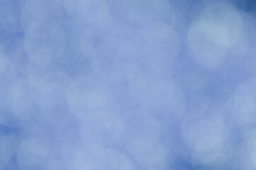 abstract blue bokeh glitter sparkle background.