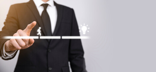Male business man hand hold a connecting block between two sets of bridge road for a silhouetted man to walk idea icon.