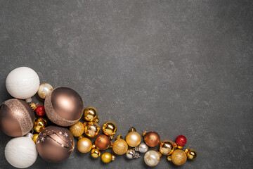 christmas baubles on dark background gold red white