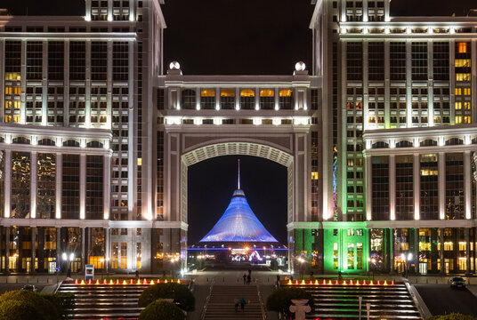 View of Astana&rsquo;s iconic gate and Baiterek Tower illuminated at night, highlighting the city&rsquo;s unique blend of modern and traditional architecture