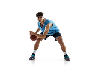 Naklejka na ściany i meble Dynamic portrait of basketball player practicing isolated on white studio background. Sport, motion, activity, movement concepts.