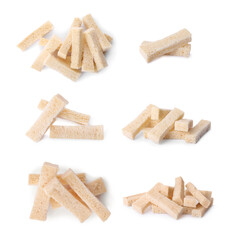 Set with delicious rusks on white background