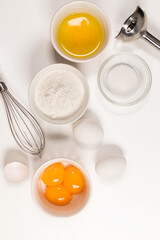 Baking utensils and cooking ingredients for tart, cookies, dough and pastry. Flat lay with eggs, flour, sugar, cottage cheese