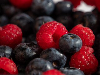 Fresh mixed berries as a background. Blueberries and raspberries.