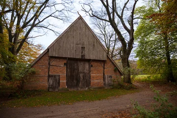 Poster de jardin  old farm in a autumn forest in holland  © Chris Willemsen