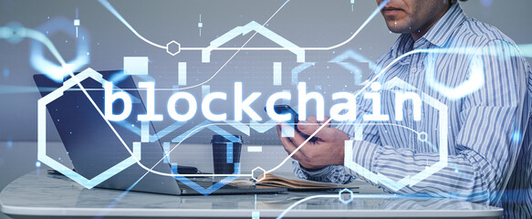 Businessman wearing formal suit is working on smartphone trading cryptocurrency