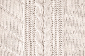 Beige knitted wool fabric texture top view