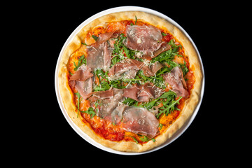 Delicious pizza close up, white plate on black background