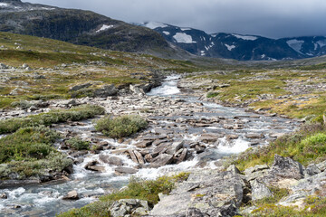 Small stream running through rocky terrain in Norway’s mountainous wilderness.