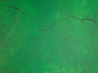 Cracks on a green background. The green texture of cracked wood.