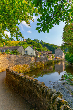 View of Castleton village and stream overlooked by Peveril Castle, Hope Valley, Peak District National Park, Derbyshire