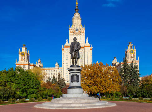 View of the monument to Mikhail Vasilyevich Lomonosov ( autumn sunny day) from the side of the main building of Moscow State University (MSU) on Sparrow Hills, Russia