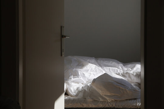 Empty unmade bed in the morning