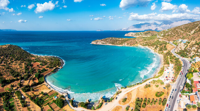 Aerial view of Almyros Beach washed by the turquoise sea in the gulf of Mirabella, Agios Nikolaos, Crete island, Greek Islands