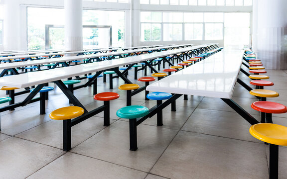 Modern School Cafeteria With Empty Seats And Tables