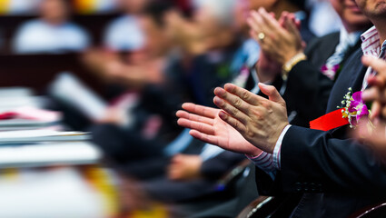 Closeup of business people hands applauding at meeting