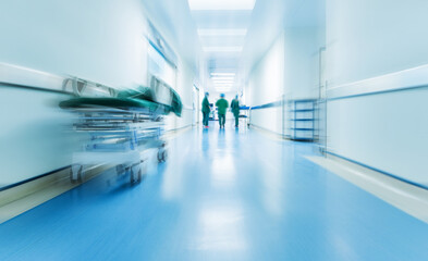 Doctors or nurses walking in hospital hallway, blurred motion