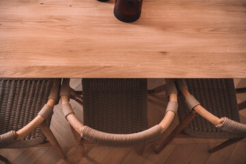 Interior of dining room with wooden table and chairs