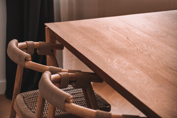 Interior of dining room with wooden table and chairs