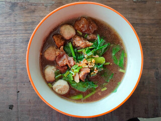 Thai boat noodles is Thailand's most famous noodles soup,Thai Boat noodles soup or Guay tiew reua ,Rice noodles thicken soup with stewed beef and beef ball