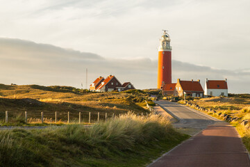 Lighthouse on the Wadden Island of Texel, Netherlands. - obrazy, fototapety, plakaty