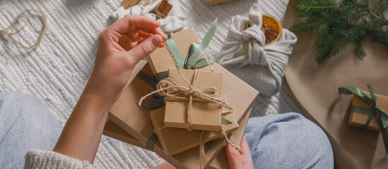 Christmas gift zero waste, eco friendly hand made box packaging gifts in kraft paper wooden table,...